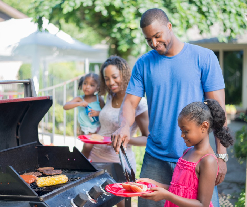 Photo of a family enjoying a barbeque