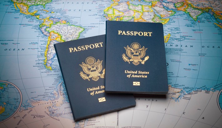 Photo of two United States Passports on a world map