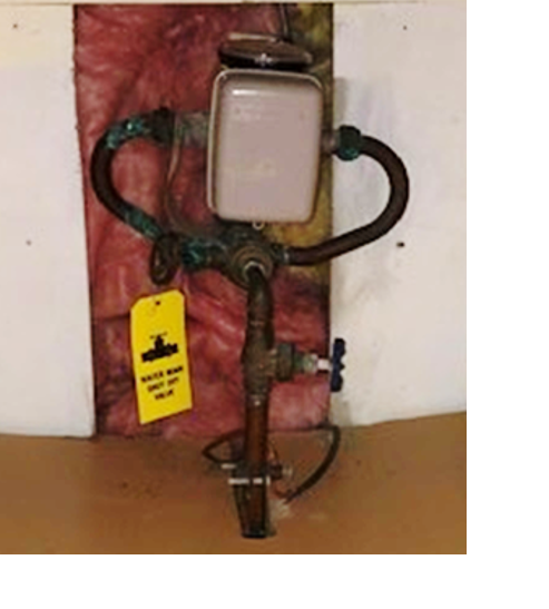 Photo of a water shut-off valve and tag