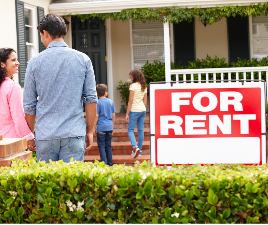 Photo of a family entering a rented home