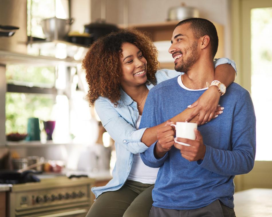 Photo of a happy couple in their kitchen