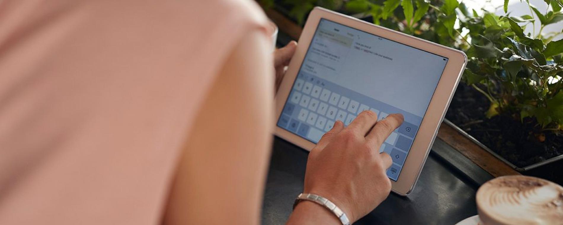 Woman reviewing information on a tablet